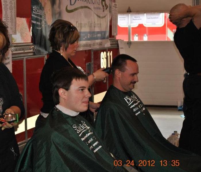 two men getting their haircut